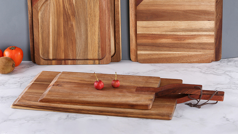 How should I handle newly purchased wooden chopping boards